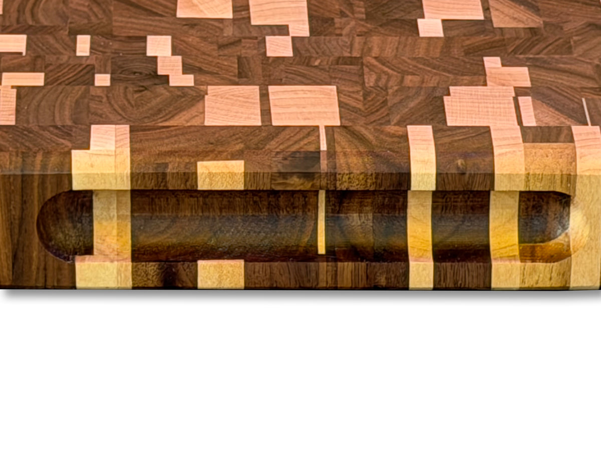 Close-up of the recessed side handle and maple and walnut mosaic pattern